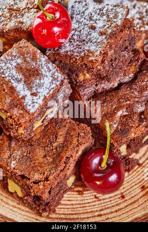 Chocolate Brownie Cake Garnished With Fruit Stock Photo - Alamy