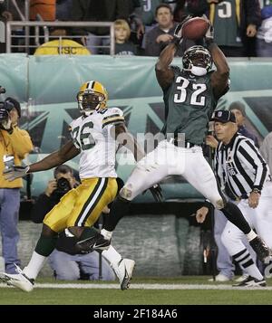 Philadelphia Eagles' Michael Lewis (32) and Ike Reese tackle Carolina  Panthers' DeShaun Foster causing him to fumble the ball in the second  quarter during the NFC championship game Sunday, Jan. 18, 2004