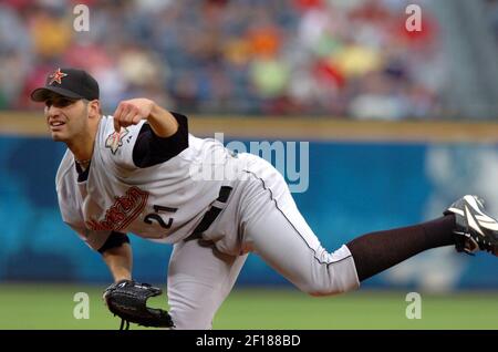 Houston Astros starting pitcher Andy Pettitte is escorted off the