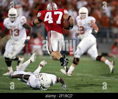 Ohio State linebacker A.J. Hawk (47) celebrates with teammate