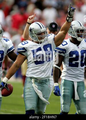 Dallas Cowboys linebacker Dat Nguyen calls out the play to the