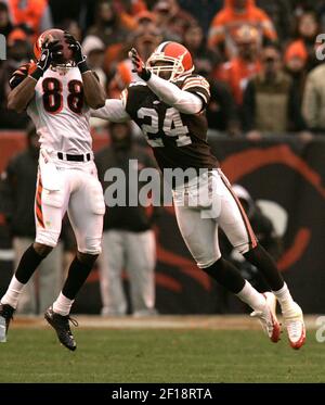 Miami Dolphins wide reciever Clyde Gates, right, bobbles a ball as he beats Cleveland  Browns defensive back Buster Skrine (22) during the final drive of the game  at Cleveland Browns Stadium in