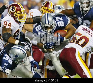 Dallas running back Eddie George escapes the grasp of a Detroit defender  during Cowboys-Lions game Oct. 31 in Irving, TX. The Cowboys defeated the  Lions 31-21. (UPI Photo/Ian Halperin Stock Photo 