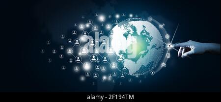 Global network connection concept. Businessman leading the global network connection with connecting people orbit around the world. World map and conn Stock Photo