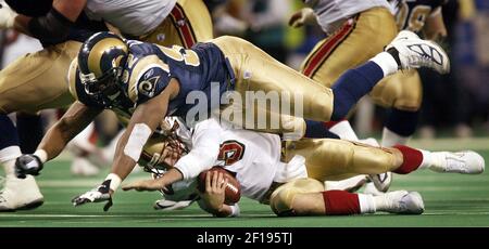 San Francisco Forty Niners quarterback Tim Rattay feels the pressure of St.  Louis Rams Damione Lewis, #92 and Leonard Littlel in the 2nd quarter of  their game at Monster Park in San