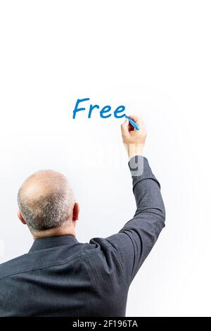 Male manager writing the word Free on a white background with a blue marker pen. Business concept Stock Photo