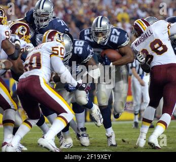 Dallas running back Eddie George escapes the grasp of a Detroit defender  during Cowboys-Lions game Oct. 31 in Irving, TX. The Cowboys defeated the  Lions 31-21. (UPI Photo/Ian Halperin Stock Photo 