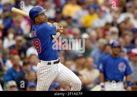 Chicago Cubs' Moises Alou hits a home run in the third inning against the  Cincinnati Reds, Friday, April 16, 2004 in Chicago. Later Alou hit a  walk-off home run in the bottom