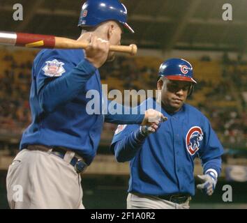 Chicago Cubs' Neifi Perez, right, is congratulated by teammates