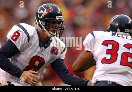 HOUP2002090801 - Houston, Sept. 8, (UPI) -- Houston Texans quarterback  David Carr (8) tries to escape the Dallas Cowboys defense during the 2nd  quarter on Sept. 8, 2002, in Houston. The Texans