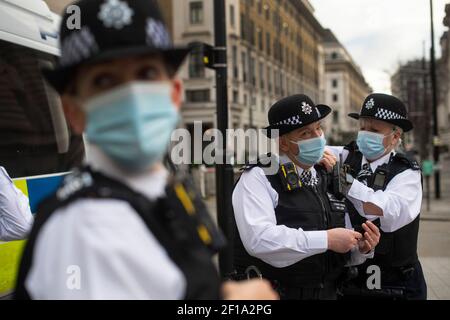 Female police officers and special constables come together on the South Bank in central London to form part of an all female operation by the Metropolitan Police, the first of its kind for the force, to mark International Women's Day. Picture date: Saturday March 6, 2021. Stock Photo