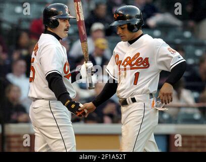 Baltimore Orioles' Brian Roberts congratulates Melvin Mora after Mora hit a  two-run homer, scoring Roberts, off Houston Astros pitcher Wandy Rodriguez  in the first inning Wednesday, June 15, 2005, in Baltimore.(AP Photo/Gail