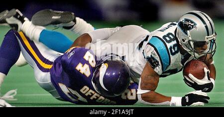 KRT SPORTS STORY SLUGGED: PANTHERS-RAMS KRT PHOTOGRAPH BY PHIL  MASTURZO/AKRON BEACON JOURNAL (December 1) CLEVELAND, OH -- Cleveland Browns  quarterback Tim Couch is taken down by Carolina Panthers Julius Peppers  during their