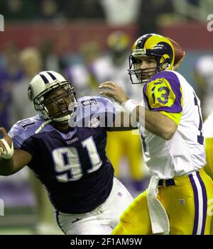 JANUARY 30 2000: Rams quarterback Kurt Warner (13) tries to avoid Titans  defense end Jevon Kearse as the St. Louis Rams defeated the Tennessee  Titans 23-17 to win Super Bowl XXXIV at