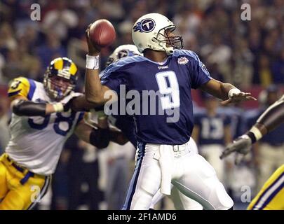 JANUARY 30 2000: Rams quarterback Kurt Warner (13) tries to avoid Titans  defense end Jevon Kearse as the St. Louis Rams defeated the Tennessee  Titans 23-17 to win Super Bowl XXXIV at