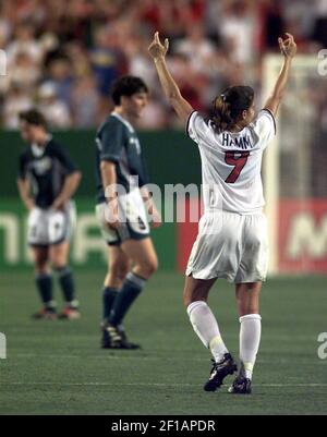 FIFA Women's World Cup - Forward Mia Hamm #9 of the USA poses for a picture  with friends, family, and husband Nomar Garciaparra during a post-game  ceremony