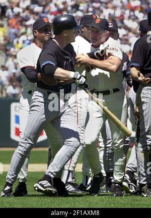 Former San Francisco Giants' Will Clark, left, hugs Robby Thompson as they  take the field as part of a tribute to the Giants' 1987 team before the  baseball game against the Florida