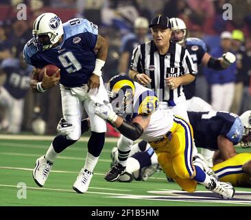 JANUARY 30 2000: Rams quarterback Kurt Warner (13) tries to avoid Titans  defense end Jevon Kearse as the St. Louis Rams defeated the Tennessee  Titans 23-17 to win Super Bowl XXXIV at