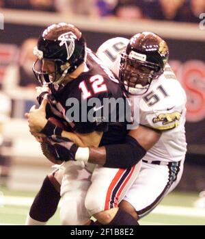 Atlanta Falcons quarterback Chris Chandler (12) is sacked by