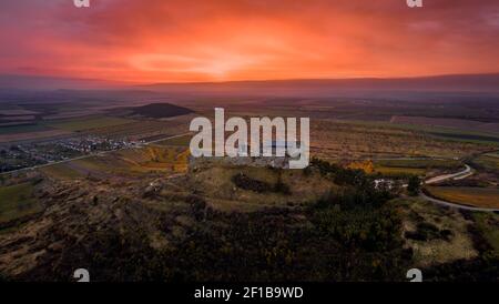 Boldogko, Hungary - Aerial panoramic view of Boldogko Castle (Boldogko vára/Boldogkováralja) at autumn season with a beautiful colorful golden sunset. Stock Photo