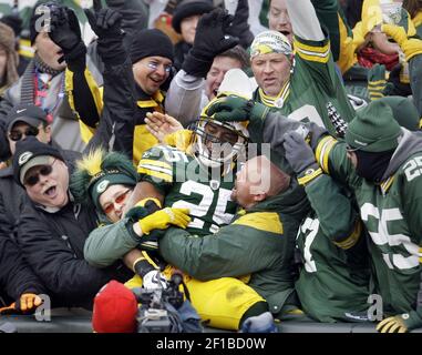 Two Green Bay Packers fans wear different style cheese head hats during the  first half of the Packers-Arizona Cardinals game at University of Phoenix  Stadium in Glendale, Arizona, December 27, 2015. Photo