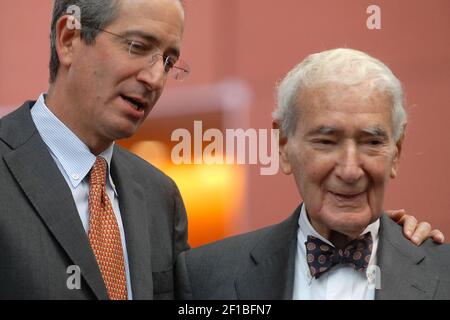 Comcast founder Ralph J. Roberts, right, and his son Brian Roberts