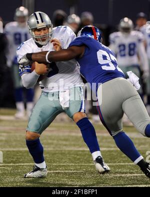 Jacksonville Jaguars running back Rashad Jennings (23) wards off New York  Giants linebacker Clint Sintim (52) on a long run into the red zone during  first half week 12 NFL action between