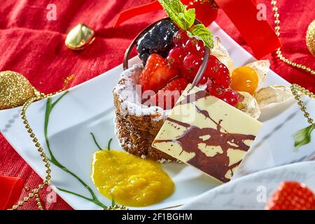 Cupcake with fresh fresh berries decoration on the table Stock Photo