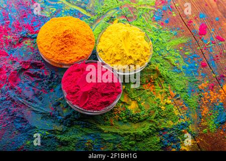 Colorful traditional holi powder in bowls. Happy holi. Concept Indian color festival called Holi. Organic Gulal dust Stock Photo