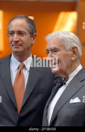 Comcast founder Ralph J. Roberts, right, and his son Brian Roberts