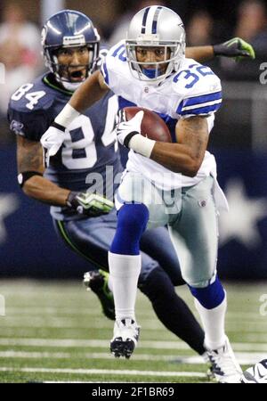 Seattle Seahawks' T.J. Houshmandzadeh (84) stretches on the field prior to  a NFL football game on Sunday, Nov. 22, 2009 against Minnesota Vikings at  the Metrodome in Minneapolis. (AP Photo/Hannah Foslien Stock