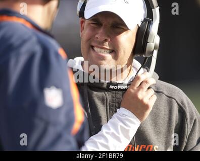 Denver Broncos head coach Josh McDaniels (R) congratulates wide receiver  Demaryius Thomas after his 21-yard touchdown pass recption against the  Seattle Seahawks at Invesco Field at Mile High on September 19, 2010