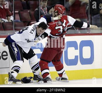 New Jersey Devils' Bryce Salvador, top, punches Tampa Bay Lightning's Zenon  Konopka (28) during a second-period fight an NHL hockey game Thursday, Oct.  8, 2009, in Tampa, Fla. (AP Photo/Chris O'Meara Stock