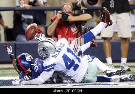 Washington Redskins wide receiver Santana Moss misses a pass from  quarterback Jason Campbell as he is covered by Dallas Cowboys Ken Hamlin  (26) and Terence Newman (41) during the third quarter at