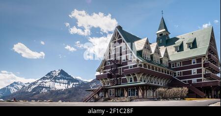 Fancy hotel surrounded by mountains, shot in Waterton National Park, Alberta, Canada Stock Photo