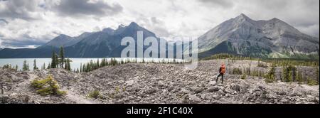 Hiking in canadian rockies, panoramic shot with mountains, forest and lake shot at Upper Kananaskis Lake trail, Alberta, Canada Stock Photo