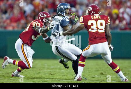 Seattle Seahawks wide receiver Ricardo Lockette (83) celebrates with  teammates, Doug Baldwin (89), Derrick Coleman (40) and Russell Wilson (3)  after catching a 39-yard touchdown pass from wilson against the Denver  Broncos