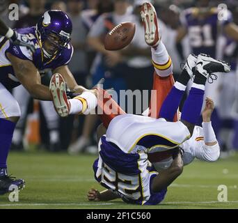 Minnesota Vikings defensive tackle Pat Williams looks at a replay