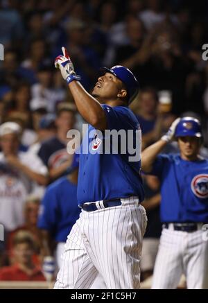 Chicago Cubs' Carlos Zambrano points to the sky as he crosses home plate  after hitting a home run during the fourth inning of a baseball game  against the Cincinnati Reds, Friday, April