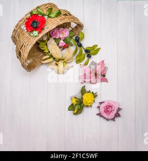 Artificial flowers on a wooden board Stock Photo