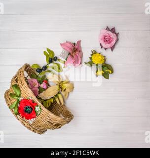 Artificial flowers on a wooden board Stock Photo