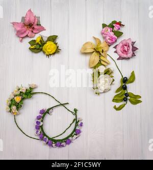 Artificial flowers on a wooden board Stock Photo
