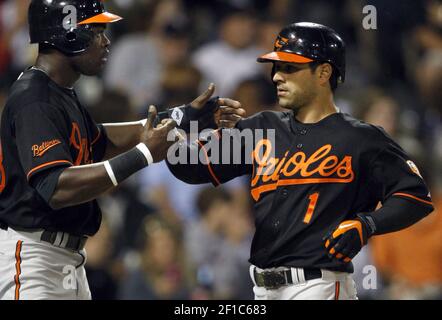 Baltimore Orioles' Brian Roberts congratulates Melvin Mora after Mora hit a  two-run homer, scoring Roberts, off Houston Astros pitcher Wandy Rodriguez  in the first inning Wednesday, June 15, 2005, in Baltimore.(AP Photo/Gail