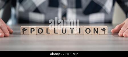 Concept of air pollution on wooden cubes Stock Photo