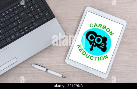 Carbon reduction concept shown on a digital tablet Stock Photo
