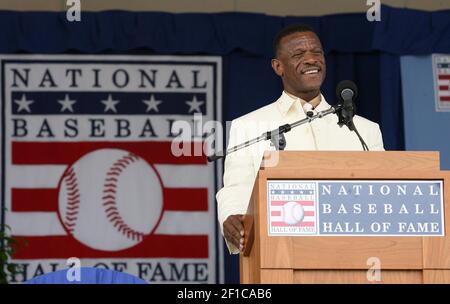 Former Oakland Athletics star and Hall of Famer Reggie Jackson, left,  stands with Josh Reddick in right field and acknowledges the crowd as the  1973 World Series championship team is honored in