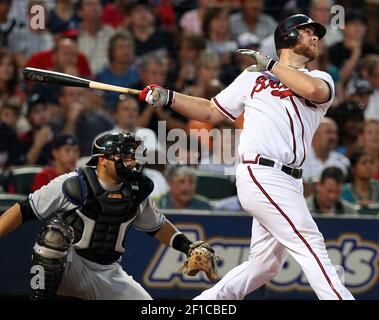 Braves catcher Brian McCann enjoys family time with his 1-year old son,  Colt, before Atlanta's game against the Miami Marlins at Turner Field in  Atlanta, Georgia, Sunday, August 11, 2013. (Photo by