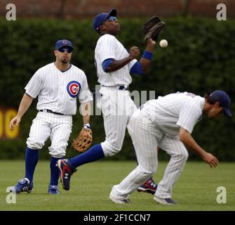 Chicago Cubs' Reed Johnson, left, celebrates with Jim Edmonds, right, after  his tie-breaking two-run home run during the eighth inning of their 8-5 win  over the Pittsburgh Pirates at Wrigley Field in