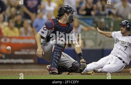 Milwaukee Brewers J.J. Hardy gets a fist with thumbs up from first base  coach Eddie Sedar after hitting a two run RBI single off of St. Louis  Cardinals pitcher Todd Wellemeyer in