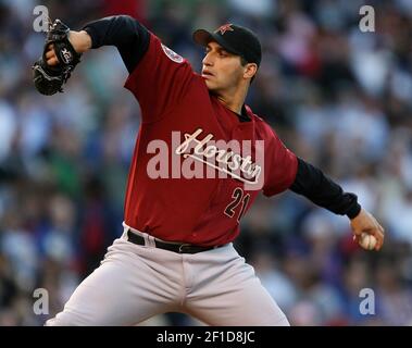 Houston Astros starting pitcher Andy Pettitte is escorted off the field by  a team trainer after injuring his elbow in the third inning against the St.  Louis Cardinals at Busch Stadium in